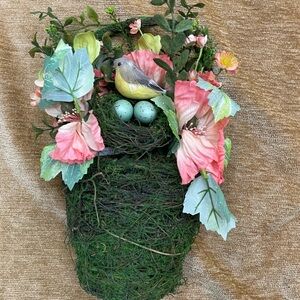 Spring floral arrangement with birds nest